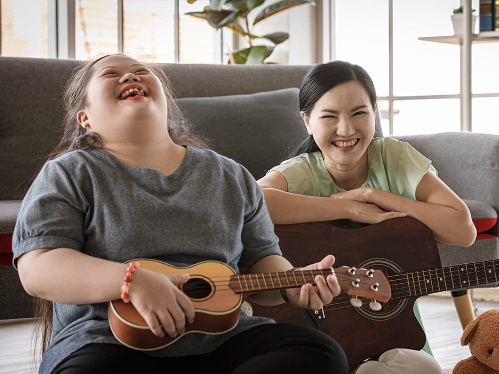 Mentee playing guitar