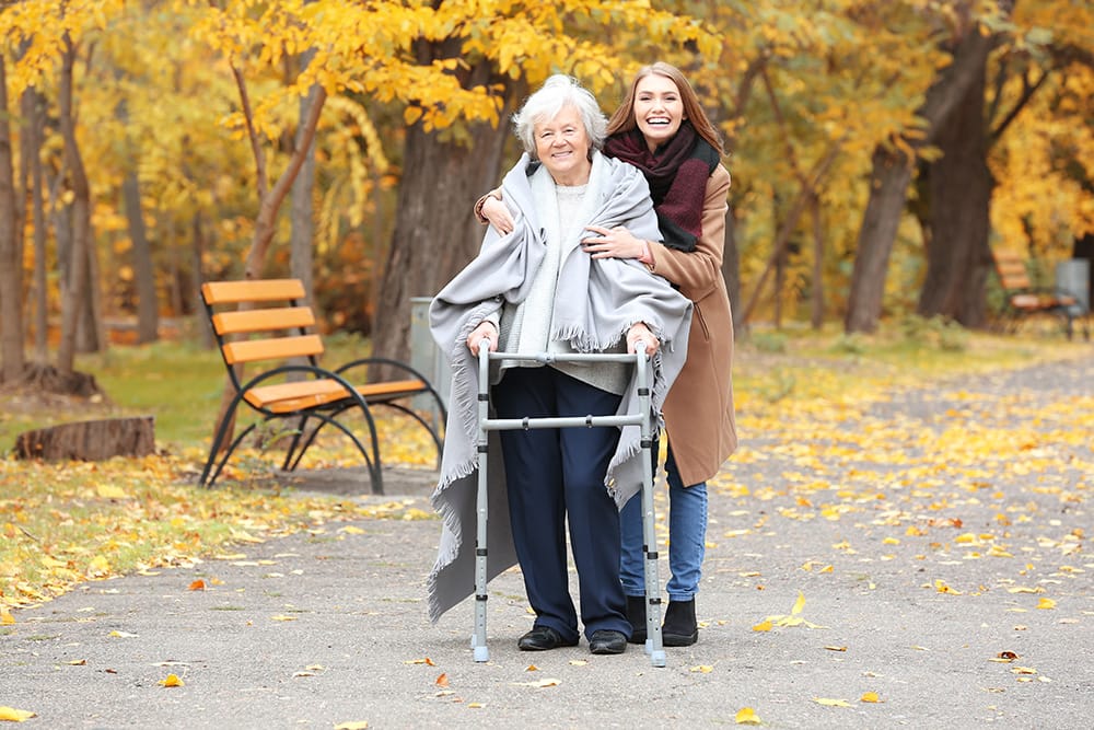 Helping a woman take a walk in the park